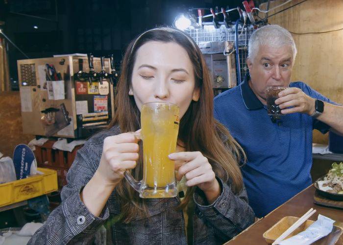 Shizuka sipping on the sweet tanginess of Kagoshima tangerine whisky and soda.